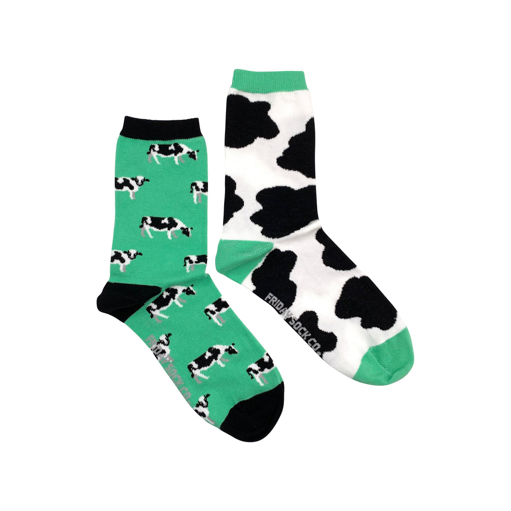 green socks with cow print and cows