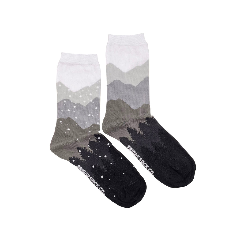 grey socks with mountains and trees under falling snow