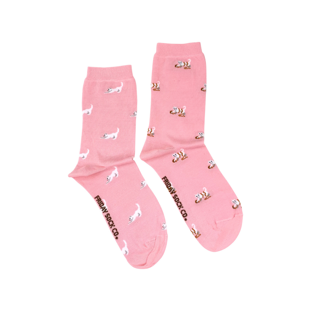 pink socks with white cats playing in yarn