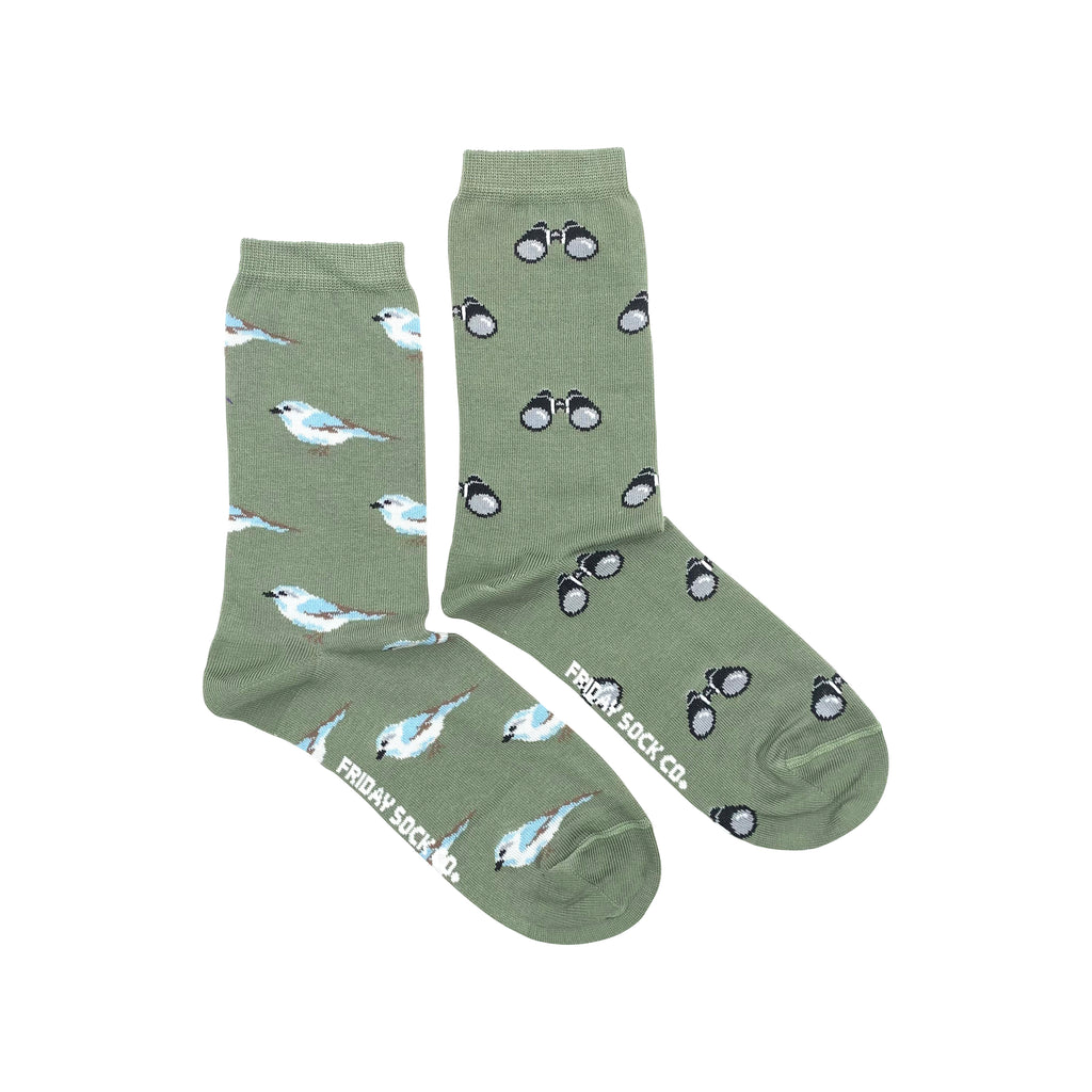 green socks with white and blue birds and binoculars