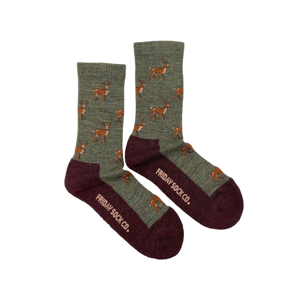 Green wool socks with brown sole and deer