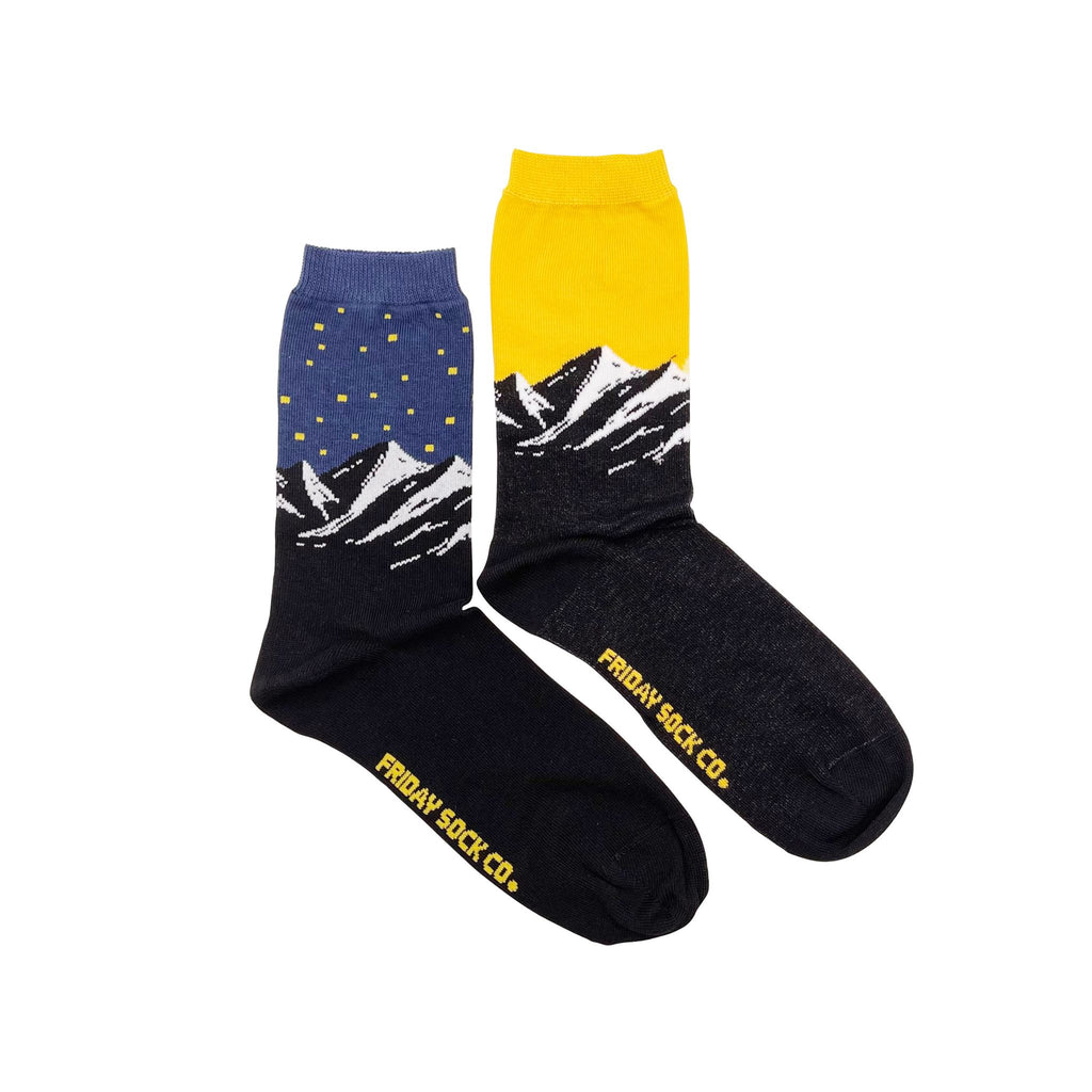 colorful socks with mountains under a starry and sunny sky